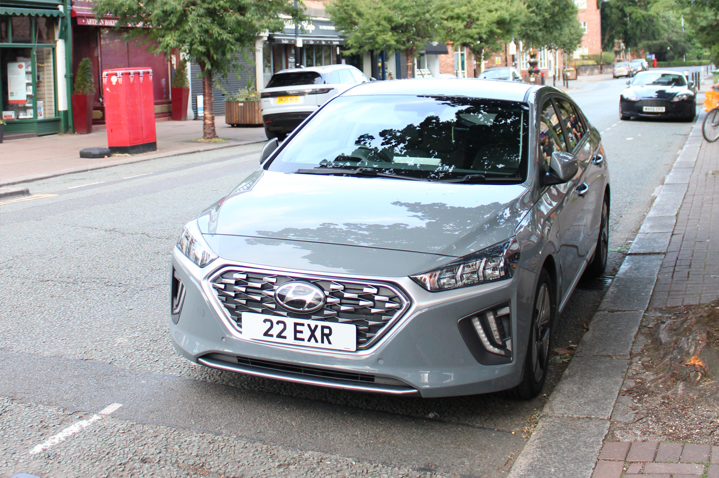 The front of our primary vehicle, a Hyundai Ioniq Hybrid with the '22 EXR' number plate parked in Hale, Greater Manchester.